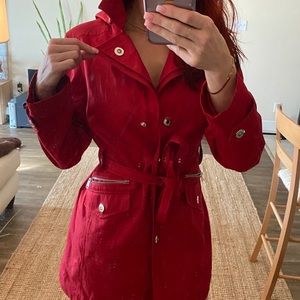 Bright red London fog rain coat